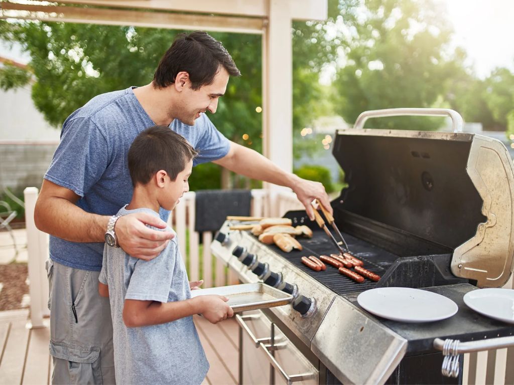 Father and son barbecuing